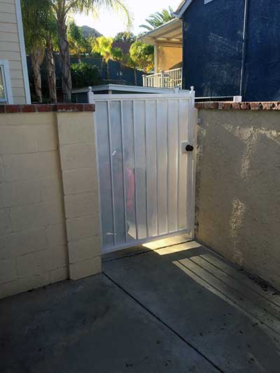Cute White Steel Gate on Side of Home
